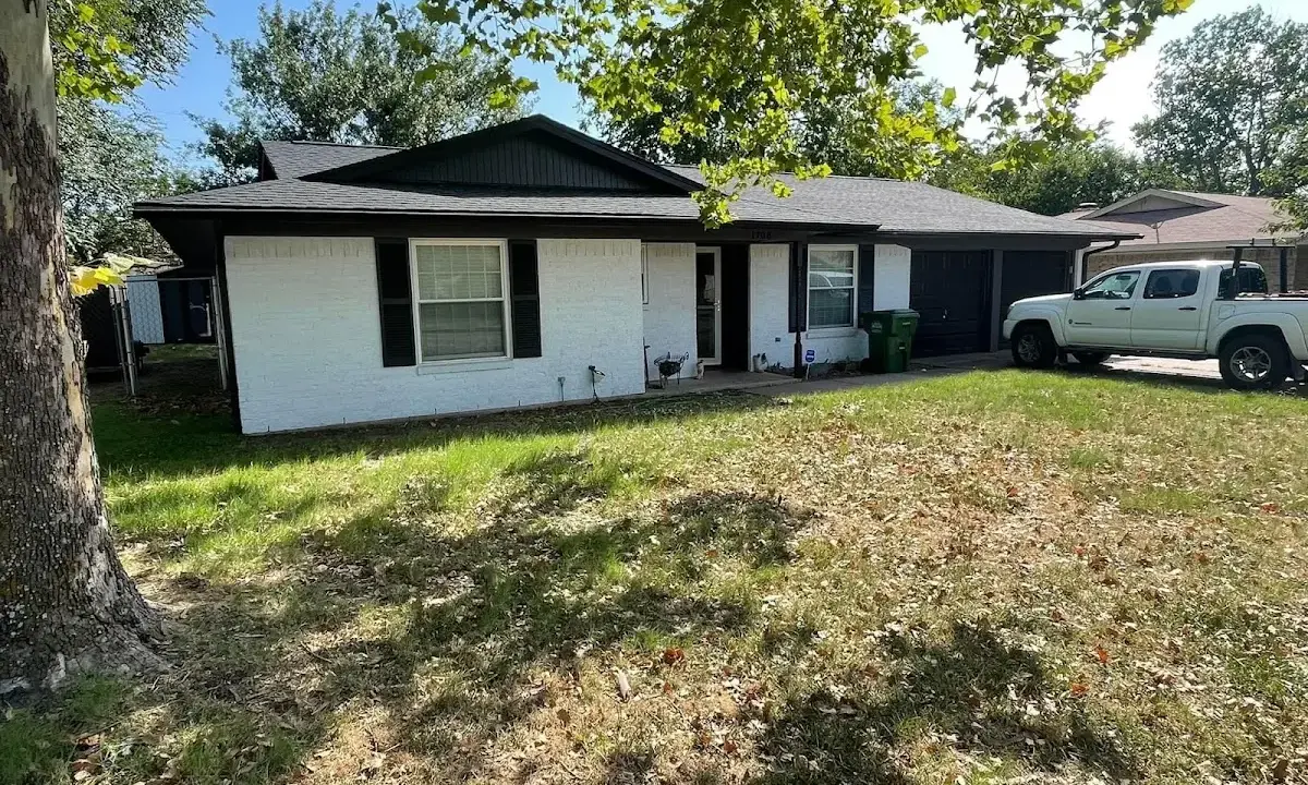 Professional roofing crew working on a residential roof in Timonium